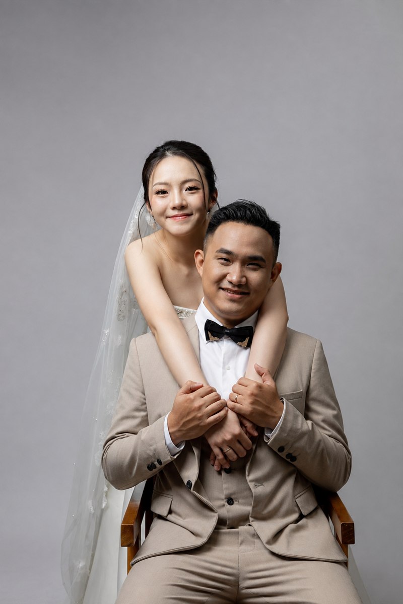 Caroline embracing Ying Lin in a studio portrait
